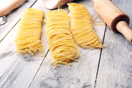 pasta. Fresh homemade pasta with pasta ingredients on the rustic tableの写真素材