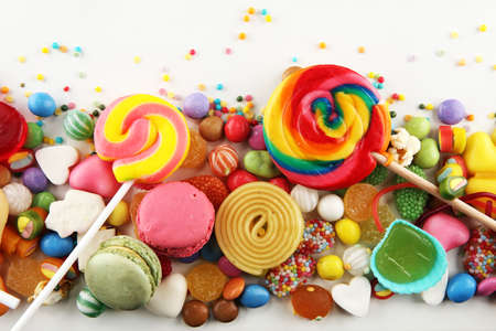 candies with jelly and sugar. colorful array of different childs sweets and treatsの写真素材
