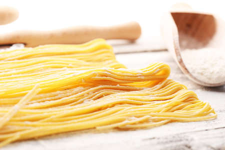 pasta. Fresh homemade pasta with pasta ingredients on the rustic tableの写真素材