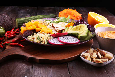 grilled tofu and dragon fruit buddha bowl with vegetable and humus.の写真素材