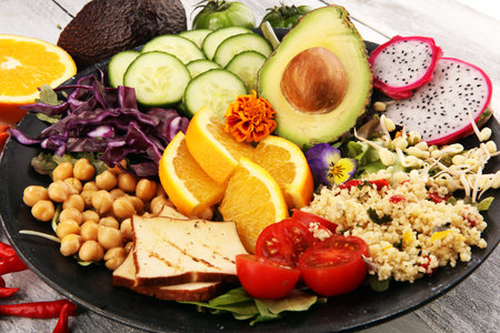 grilled tofu and dragon fruit buddha bowl with vegetable and humus.
