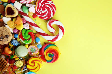 candies with jelly and sugar. colorful array of different childs sweets and treatsの写真素材