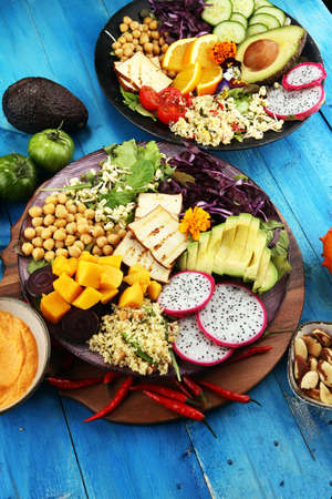 grilled tofu and dragon fruit buddha bowl with vegetable and humus.の写真素材