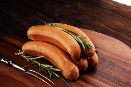 raw sausages with spices on a wooden table - Home-made Pork Sausages for barbecueの写真素材