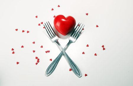 Festive table setting for Valentine's Day with forks and hearts