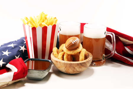 fries, beer and onion rings for football on a table. Great for Bowl football Gameの写真素材