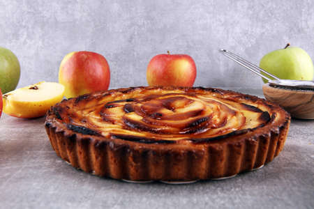 Gourmet traditional holiday apple pie sweet baked dessert food with cinnamon and apples on table for dessertの写真素材