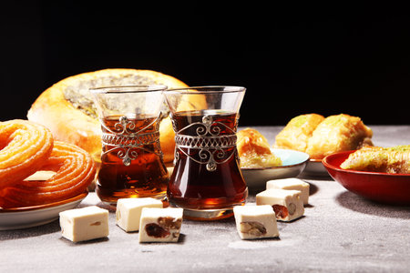 Middle eastern or arabic dishes and assorted meze, concrete rustic background. sambusak. Turkish Dessert Baklava with pistachio. Halal food. Lebaneseの写真素材