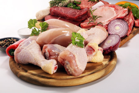 raw meat. Different types of raw pork meat, chicken and beef with spices and herbs and sausagesの写真素材