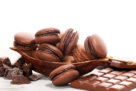 Sweet and colourful french macaroons or macaron with chocolate for dessertの写真素材