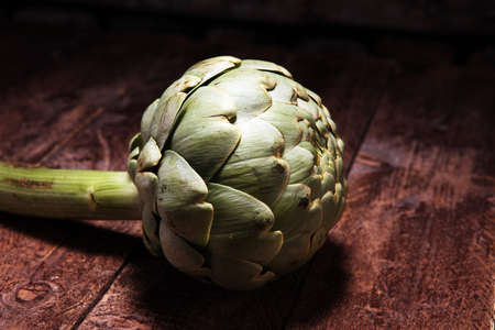 artichokes on old rustic background. fresh organic artichoke flowerの写真素材