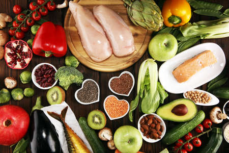 Healthy food clean eating selection. fruit, vegetable, seeds, superfood, cereals, leaf vegetable and fish and chicken.の写真素材