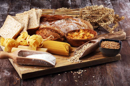 whole grain products with complex carbohydrates on rustic tableの写真素材