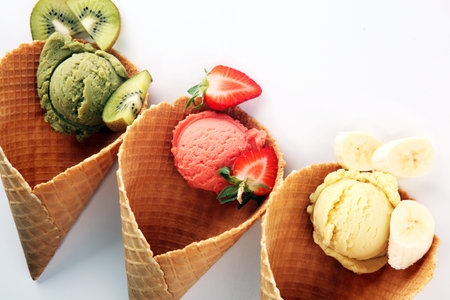 Set of ice cream scoops of different colors and flavours with berries and fruits decoration....