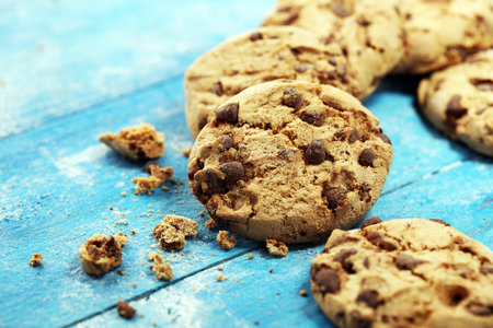 Chocolate cookies on wooden table. Chocolate chip cookies shot. Homemade food
