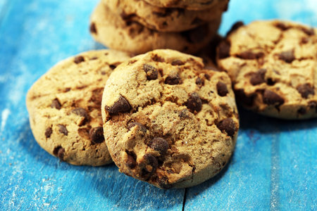 Chocolate cookies on wooden table. Chocolate chip cookies shot. Homemade food