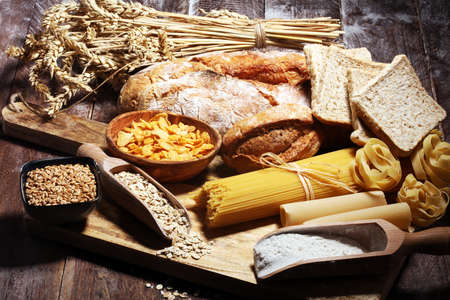 whole grain products with complex carbohydrates on rustic tableの写真素材