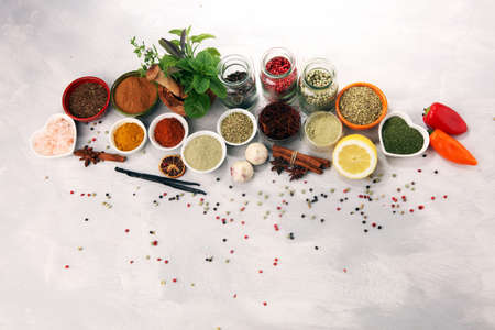 Spices and herbs on table. Food and cuisine ingredients on white tableの写真素材