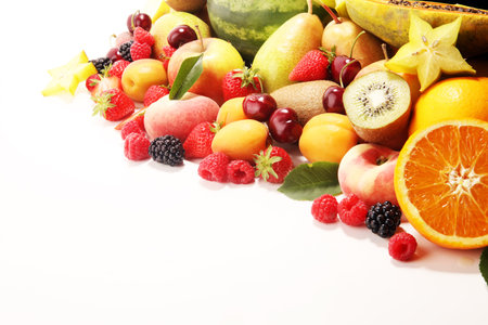 Fresh summer fruits with apple, peach, berries, pear and apricot on white