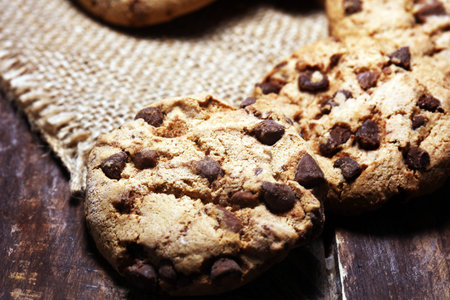 Chocolate cookies on wooden table. Chocolate chip cookies shot