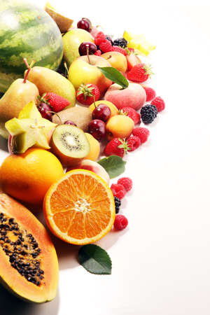 Fresh summer fruits with apple, peach, berries, pear and apricot on whiteの写真素材