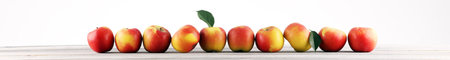 Ripe red apples with leaves on light wooden background