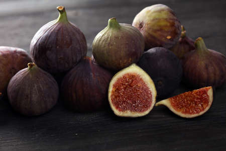 Fresh figs. Food Photo. whole and sliced figs on rustic tableの写真素材