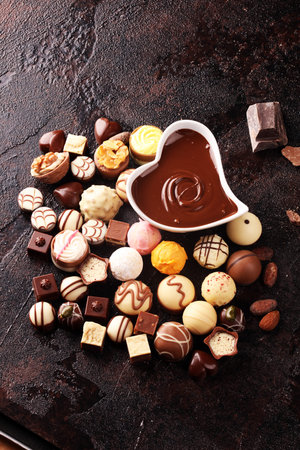 a lot of variety chocolate pralines, belgian confectionery gourmet chocolate on table