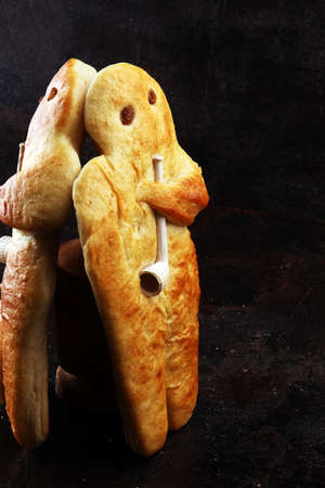 stutenkerl or weckmann. baked traditional german pastery on darkの写真素材