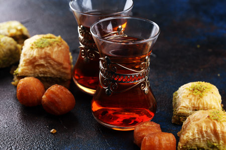 Baklava on table. Middle eastern or arabic dishes. Turkish Dessert Baklava with pistachio on rustic...