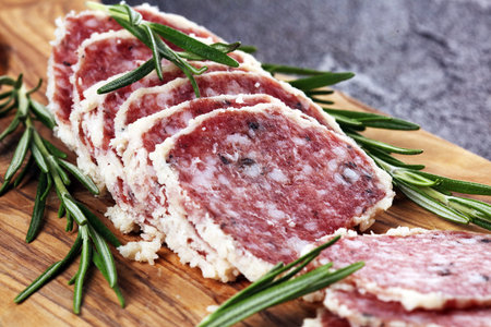 Salami truffle. The saltufo is a piece of salami mixed with summer truffle on table