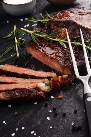 Barbecue Rib Eye Steak or rump steak - Dry Aged Wagyu Entrecote Steak on tableの写真素材