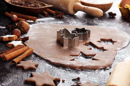 Baking christmas cookies. Typical cinnamon stars bakery with spices. xmas decorationの写真素材