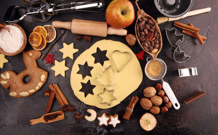 Baking christmas cookies. Typical cinnamon stars bakery with spices. xmas decorationの写真素材