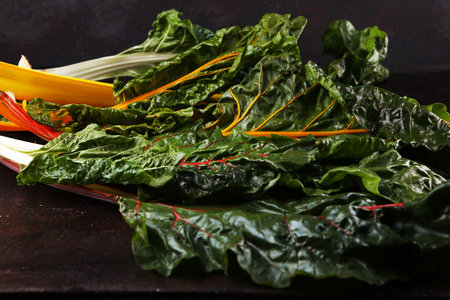 organic swiss chard in yellow, pink red and green. colorful chard