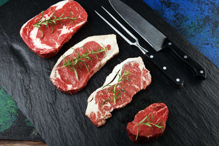 Steak raw. Barbecue Rib Eye Steak, dry Aged Wagyu Entrecote. Variety of Raw Black Angus Prime meat steaks Machete, Striploin, Rib eye, Tenderloin fillet mignonの写真素材