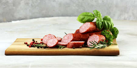 sausage slices, smoked meat product (tasty snack salami) menu concept. food background. cracow smoked meat cutsの写真素材