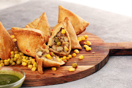 Vegetarian samsa or samosas.Indian special traditional street food punjabi samosa or Coxinha,...