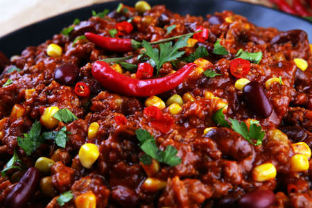 Hot chili con carne. mexican food tasty and spicy with pepper and kidneysの写真素材