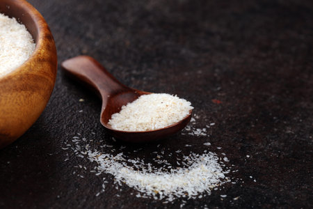 Portion of Psyllium Seeds on rustic background. Psyllium seed husks on wooden