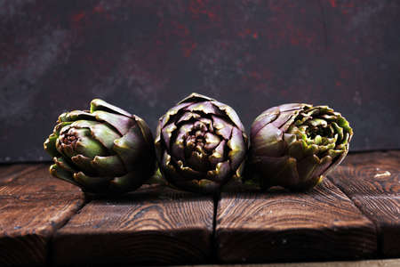artichokes on rustic background. fresh organic raw artichoke flower の写真素材