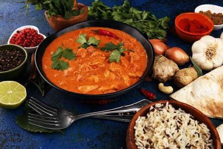 Chicken tikka masala spicy curry meat food in pot with rice and naan bread. Indian chicken tikka masalaの写真素材