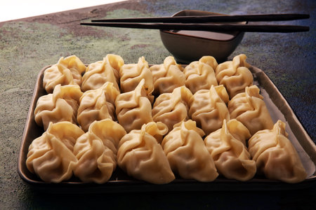 Gyoza or dumplings snack with soy sauce, selective focus, copy space.