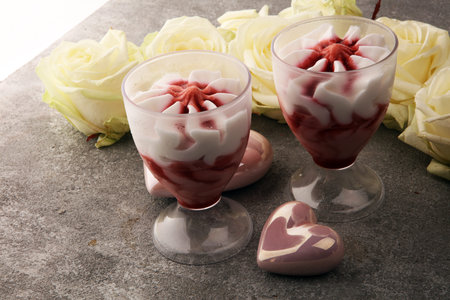 Strawberry dessert or ice cream in glasses and rose, decorated with hearts. Valentines Day