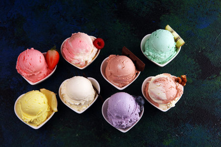 Various of ice cream flavor with fresh blueberry, strawberry, kiwi, lemon, vanilla setup on rustic...