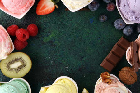 Various of ice cream flavor with fresh blueberry, strawberry, kiwi, lemon, vanilla setup on rustic background . Summer and Sweet ice creamの写真素材