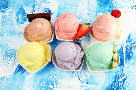 Various of ice cream flavor with fresh blueberry, strawberry, kiwi, lemon, vanilla setup on rustic...