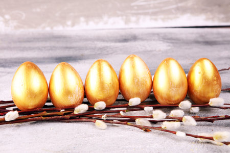 golden easter eggs and pussy willow cats. palm kitten and golden eggs for easter holiday