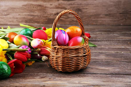 blooming daffodils and easter eggs for spring decoration on rustic backgroundの写真素材