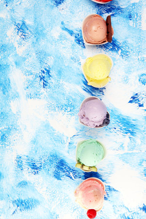 Various of ice cream flavor with fresh blueberry, strawberry, kiwi, lemon, vanilla setup on rustic...